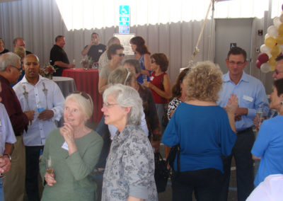 General Manager Mark Garaventa & Winemaker Penny Gadd-Coster talking with party guests under a tent during the Grand Opening in 2014.