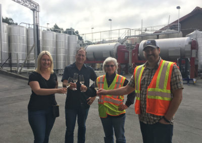 Penny Gadd-Coster toasting to 2017 Harvest season with clients.