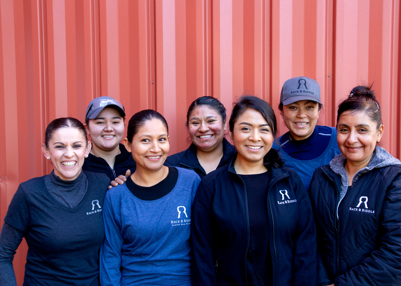 Group photo of the women who work on the production line at Rack and Riddle