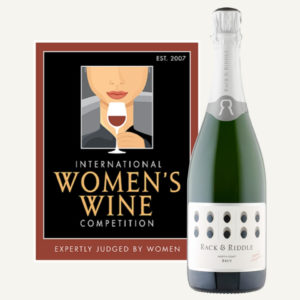 International Women's Wine Competition logo and a bottle of Rack & Riddle North Coast Brut.