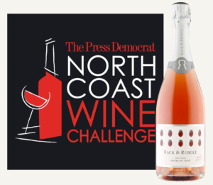 The Press Democrat North Coast Wine Challenge logo plus a bottle of  Rack & Riddle North Coast Sparkling Rosé.